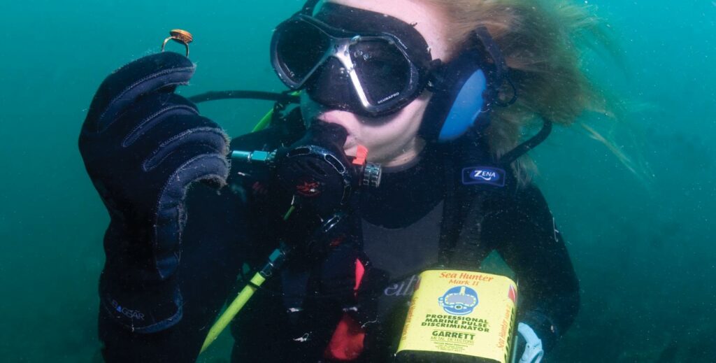 Photo Kindly Provided by Garrett Metal Detectors Diver uses an underwater metal detector to find valuable items