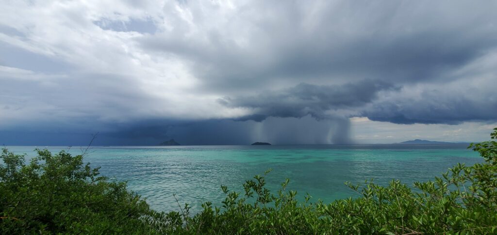Rainstorm over the ocean near Laemtong Beach - Koh Phi Phi, Thailand Rainstorm over the ocean near Laemtong Beach - Koh Phi Phi, Thailand