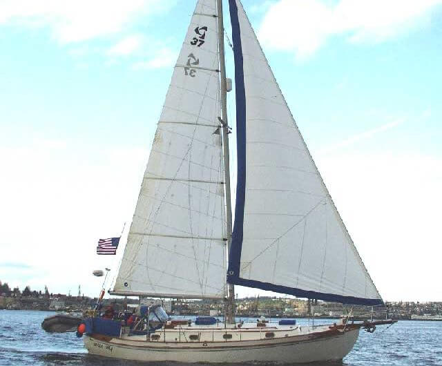 Photo Provided by: Charles Doane (Wavetrain.net) Tayana 37 bluewater sailboat with an American flag