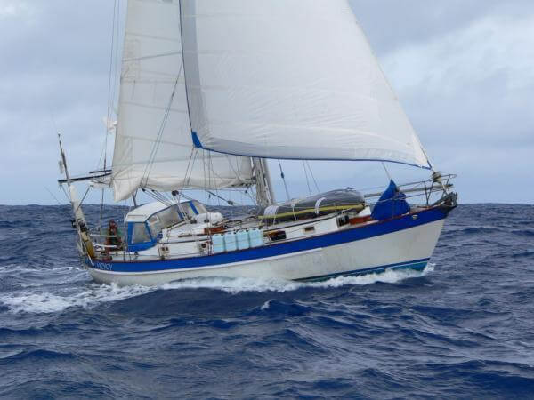Photo Provided by: Charles Doane (Wavetrain.net) Valiant 40 cruiser with white sails designed by Robert Perry
