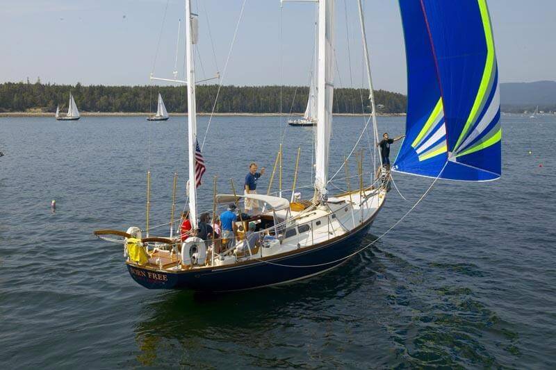 Photo Kindly Provided by Josh McLean (Davidwaltersyachts.com) Group of people on a Hinckley Bermuda 40 with blue sails