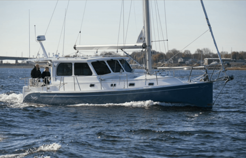 Photo Provided by: Bill Ramos (Shannonyachts.com) Two people on the back of a Shannon 38 sailboat