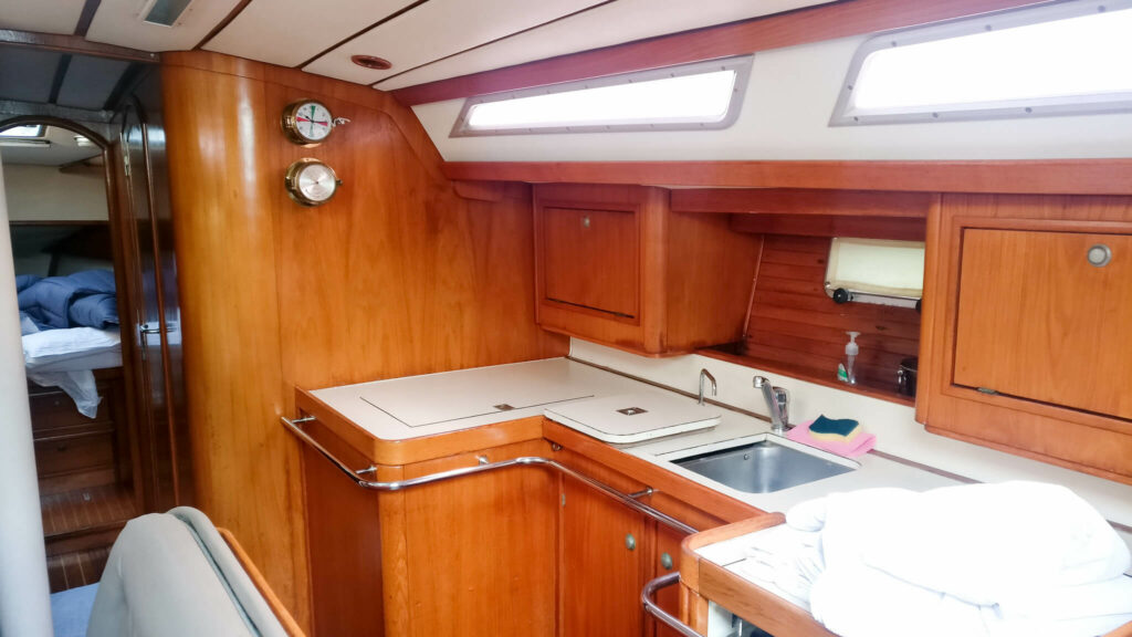 Wooden boat galley with kitchen sink Wooden boat galley with kitchen sink