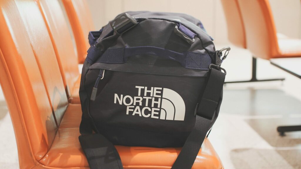 A North Face duffel bag packed for a sailing holiday A North Face duffel bag packed for a sailing holiday
