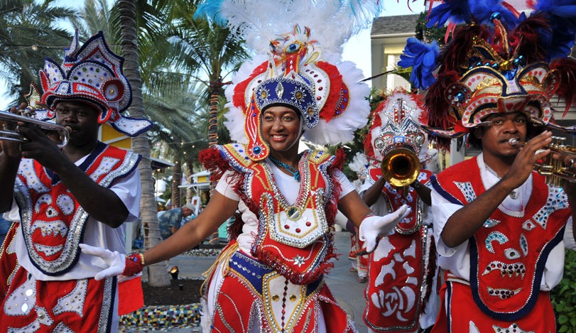 Junkanoo Festival in Nassau People dressed in colorful red, white, yellow, and blue costumes playing instruments and dancing for the Junkanoo Festival in Nassau, Bahamas