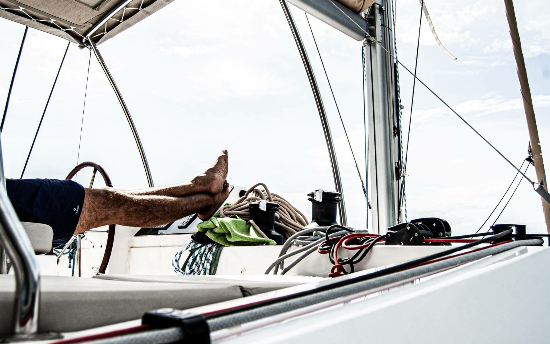A man puts his feet up while relaxing on his boat A man puts his feet up while relaxing on his boat