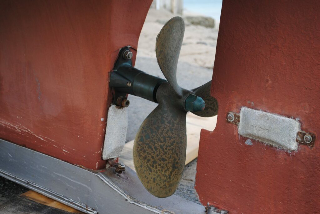 Sailboat propeller red and brown Sailboat propeller red and brown